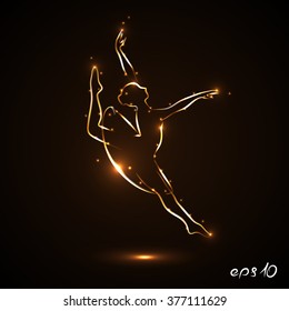 Dancer is dancing gracefully. Silhouette of a ballerina in a jump in traffic. Theatrical performance. The abstract image of a ballerina with gold contour with light flares on dark, black background.