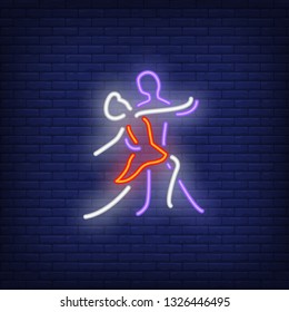 Dancers couple dancing neon sign. Dance studio or performance design. Night bright neon sign, colorful billboard, light banner. Vector illustration in neon style.