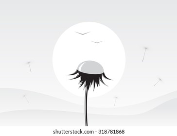 A dandelion against the sun and mountains