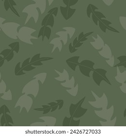 Dandelion leaves in muted greens scattered on a green background give this vector repeat seamless pattern design a look of camouflage.