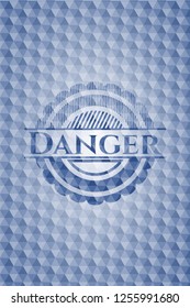 Danger blue emblem or badge with abstract geometric polygonal pattern background.