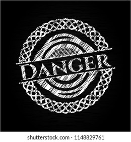 Danger chalkboard emblem on black board