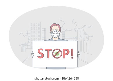 Danger or coronavirus infection epidemic, protective facial mask, pandemic concept. Young man in medical protective mask standing with sign stop in hands outdoors. Prevention of spreading outbreak 