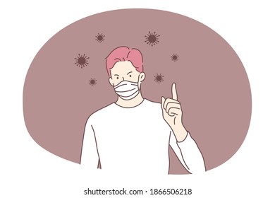 Danger or coronavirus infection epidemic, protective facial mask, pandemic concept. Young man in medical protective mask standing showing attention sign with raised finger in bacteria flowing around