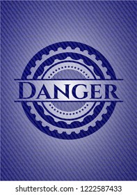 Danger emblem with jean background