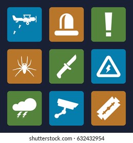 Danger icons set. set of 9 danger filled icons such as spider, thunder, razor, siren, voltage warning, security camera, knife, military plane