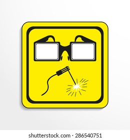Danger sign. Welding works. Vector icon.