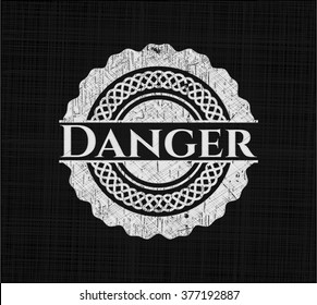 Danger written on a blackboard