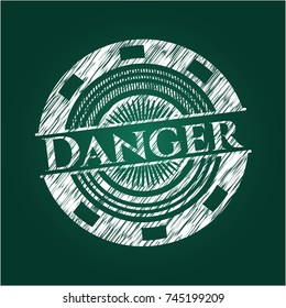 Danger written on a blackboard