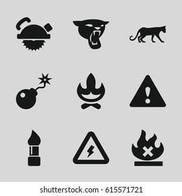 Dangerous icons set. set of 9 dangerous filled icons such as panther, brush, saw blade, no fire, bomb, warning, voltage warning