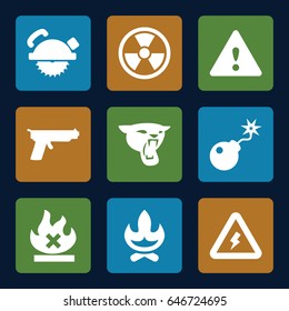 Dangerous icons set. set of 9 dangerous filled icons such as panther, saw blade, no fire, bomb, warning, voltage warning, gun, radiation