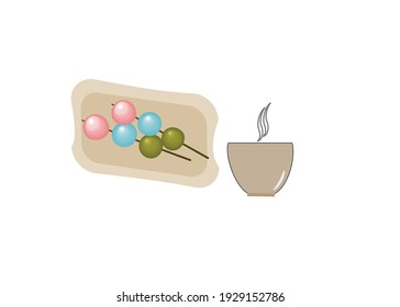 Dango on plate with a cup of tea. Japanese Dango dessert with three different colors. Isolate on white background.copy pace,for your text.