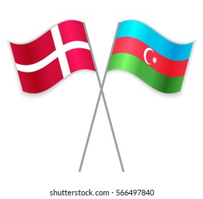 Danish and Azeri crossed flags. Denmark combined with Azerbaijan isolated on white. Language learning, international business or travel concept.