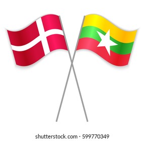 Danish and Burmese crossed flags. Denmark combined with Myanmar isolated on white. Language learning, international business or travel concept.