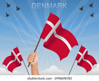 Danish flags fluttering under the blue sky