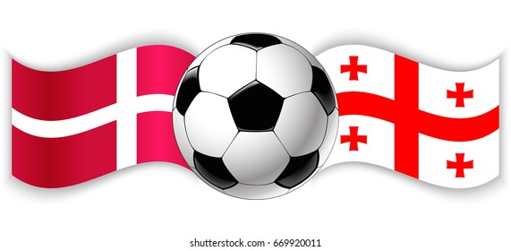 Danish and Georgian wavy flags with football ball. Denmark combined with Georgia isolated on white. Football match or international sport competition concept.