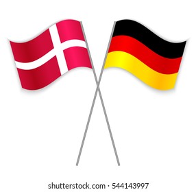 Danish and German crossed flags. Denmark combined with Germany isolated on white. Language learning, international business or travel concept.