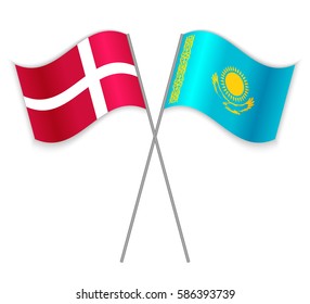 Danish and Kazakh crossed flags. Denmark combined with Kazakhstan isolated on white. Language learning, international business or travel concept.