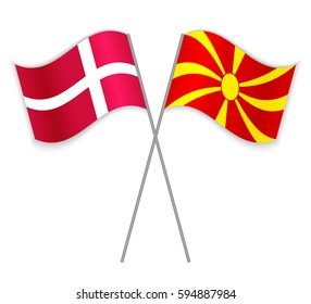 Danish and Macedonian crossed flags. Denmark combined with Macedonia isolated on white. Language learning, international business or travel concept.