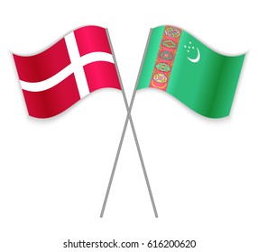 Danish and Turkmen crossed flags. Denmark combined with Turkmenistan isolated on white. Language learning, international business or travel concept.