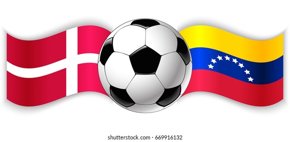 Danish and Venezuelan wavy flags with football ball. Denmark combined with Venezuela isolated on white. Football match or international sport competition concept.