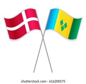 Danish and Vincentian crossed flags. Denmark combined with Saint Vincent and the Grenadines isolated on white. Language learning, international business or travel concept.
