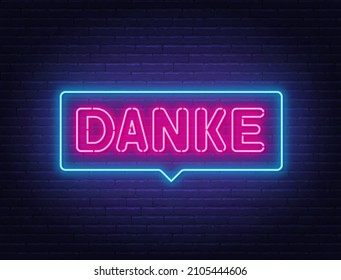 Danke neon sign in the speech bubble on brick wall background.