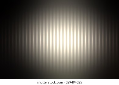 Dark abstract blur colored background with defocused vertical rays of light.