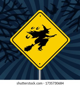 Dark background with branches and a road sign (Yellow Square) "Caution, Halloween" is a black Silhouette of the Witch in a Witch Hat Flying on the Broom