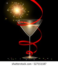 dark background and the glass of champagne with burning sparkler inside, red tape and confetti