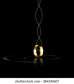 dark background and the single golden ring with chain