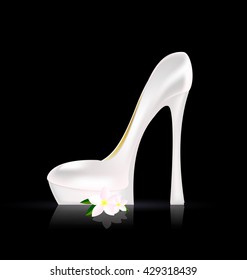 dark background and the white ladys shoe with flower