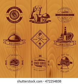 Dark BBQ vintage logo set different sizes and titles on wooden background vector illustration