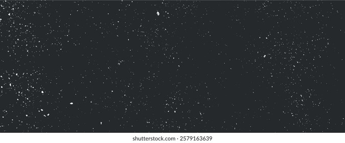 Dark black background with a speckled texture, resembling a starry night. The black background adds depth and a cosmic feel. Speckled wall texture background. Black background vector.