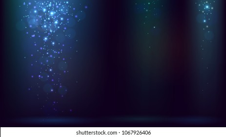 Dark blue background with rays of light and falling spangles or snow, shimmering dust