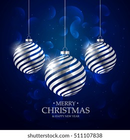 dark blue background with silver christmas balls and bokeh effect