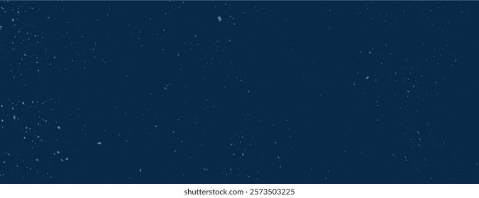 Dark blue background with a speckled texture. The background features a starry effect with a deep blue color, creating a night sky feel. Speckled wall texture background. Blue background vector.