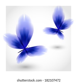 Dark blue butterflies fluttering air