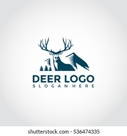 Dark blue Deer Logo tempale. feat mountain and tree. vector illustrator eps.10