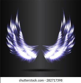 dark blue glowing, stylized angel wings on a black background. vector