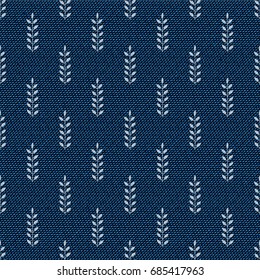 Dark blue jeans seamless texture. Denim background with branches with leaves. Can be used for wallpaper, pattern fills, web page background, surface textures. Denim texture