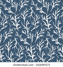 Dark blue seamless pattern with white hand drawn inky branches and twigs. Monochrome winter traditional chinese ink floral elements texture for textile, wrapping paper, cover, surface, wallpaper