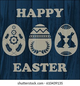 Dark blue wooden laminate background with Easter eggs silhouettes