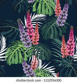 Dark and bright tropical leaves with jungle plants. Seamless vector tropical pattern with green palm and monstera leaves and lupines flowers. Black background.