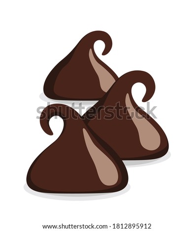 Dark chocolate chips or drops isolated on white background.