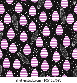 Dark easter seamless pattern. Art striped eggs with hand drawn feathers insolated against a black background.