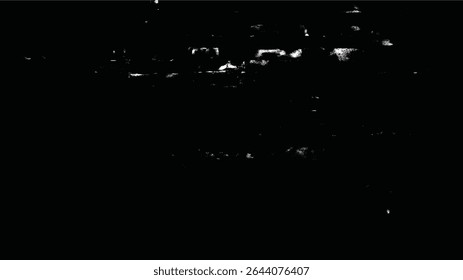 uma imagem abstrata escura e granulada com formas desfocadas e manchas brancas espalhadas pela área da superfície