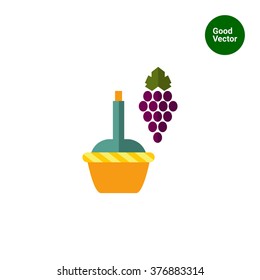 Dark grape bunch with wine bottle