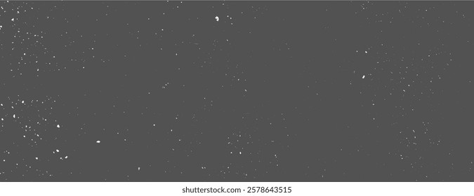 Dark gray background with a speckled texture. The gray background features scattered white specks, creating a starry effect. Speckled wall texture background. Gray background vector.