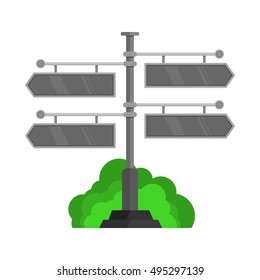 dark gray direction boards in front of the bushes